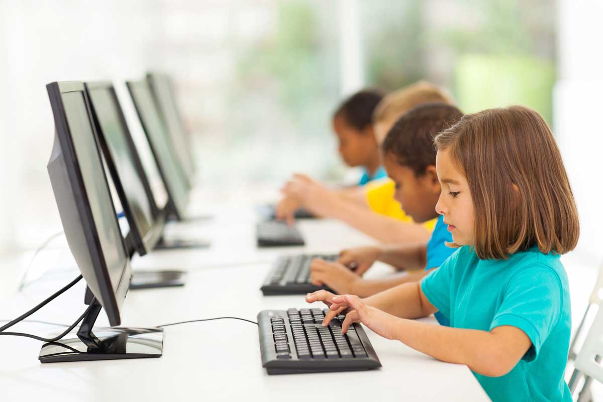 elementary school students during typing classes